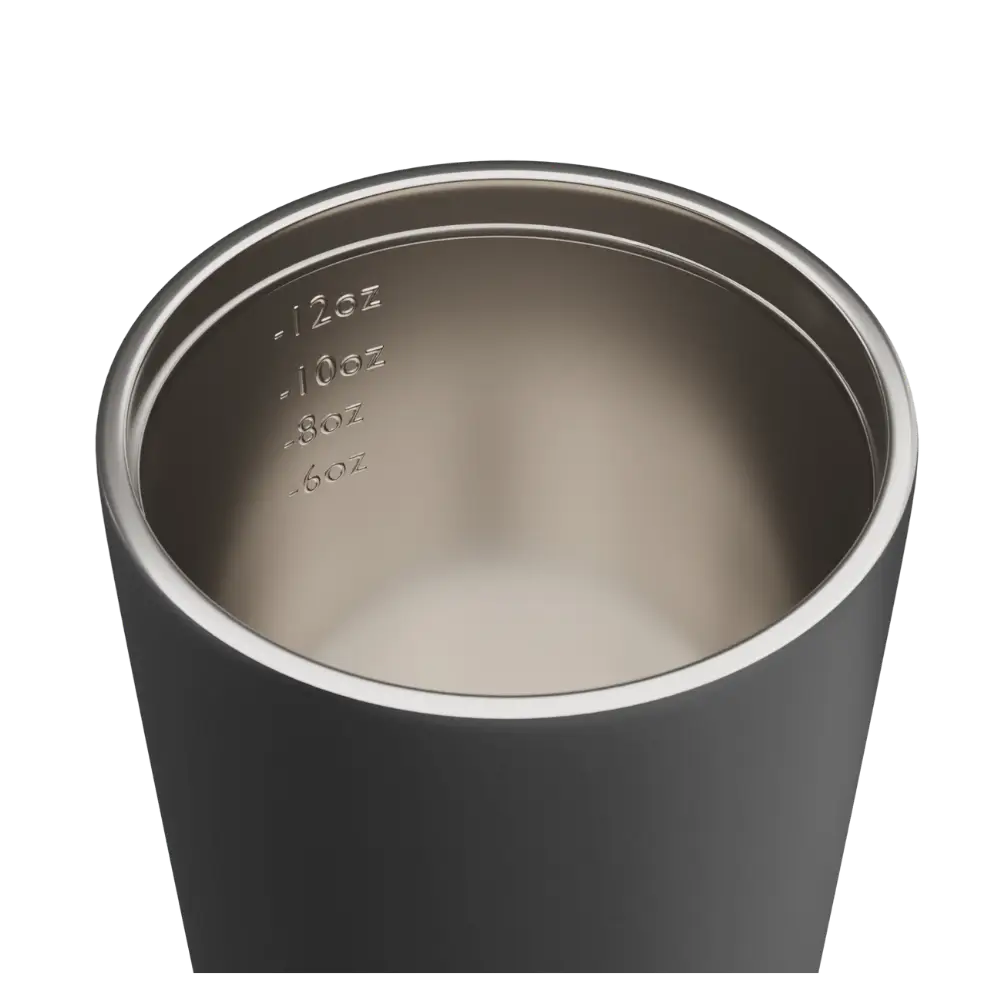 Stainless steel tumbler with black exterior on a white background